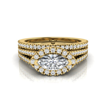 Marquise cut lab grown diamond halo engagement ring set with split shank design and matching pavé diamond wedding band in yellow gold.