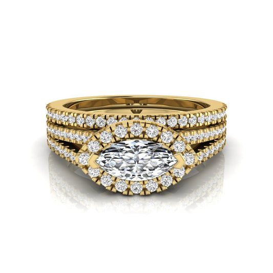 Marquise cut lab grown diamond halo engagement ring set with split shank design and matching pavé diamond wedding band in yellow gold.