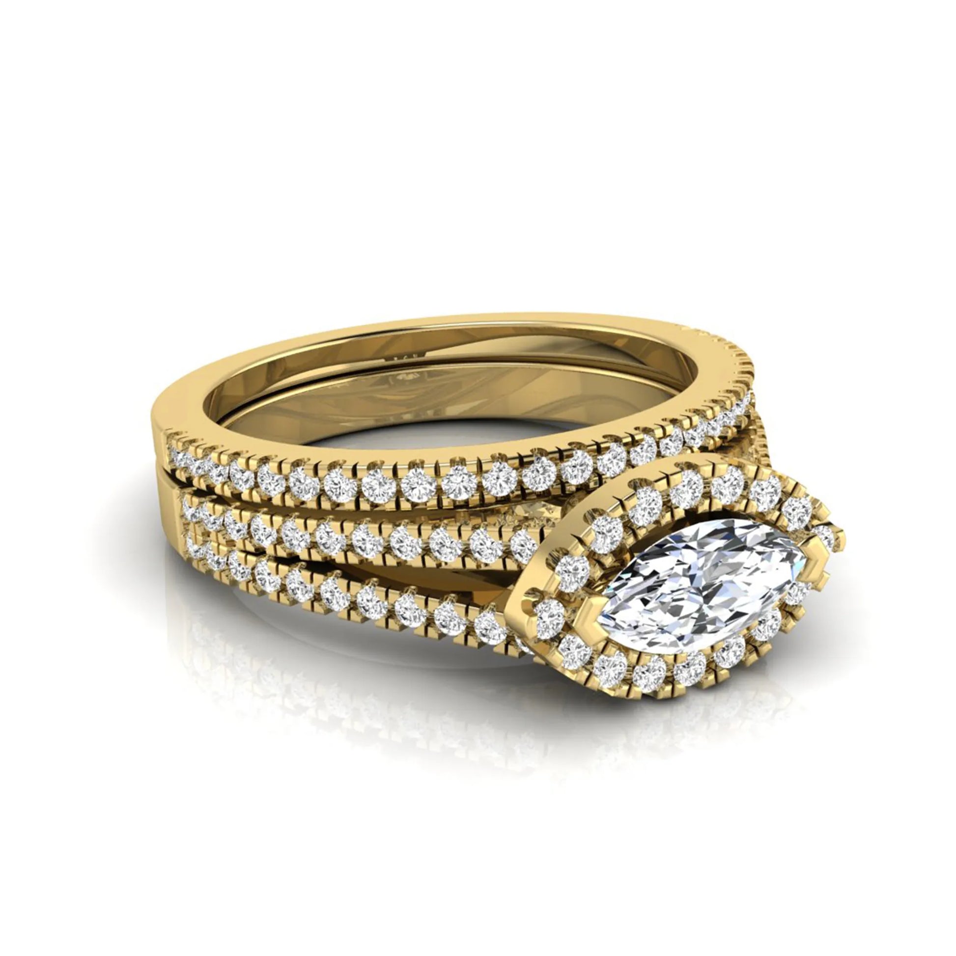 Marquise cut lab grown diamond halo engagement ring set with split shank design and matching pavé diamond wedding band in yellow gold.