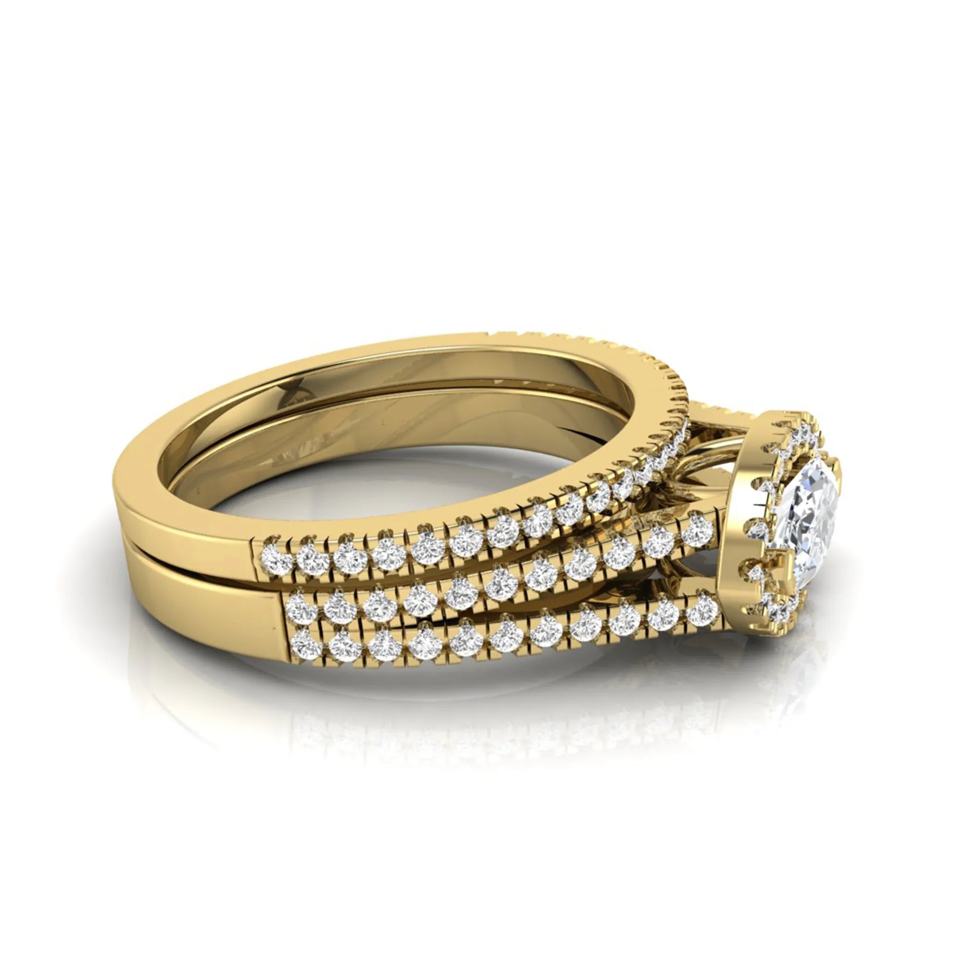 Marquise cut lab grown diamond halo engagement ring set with split shank design and matching pavé diamond wedding band in yellow gold.