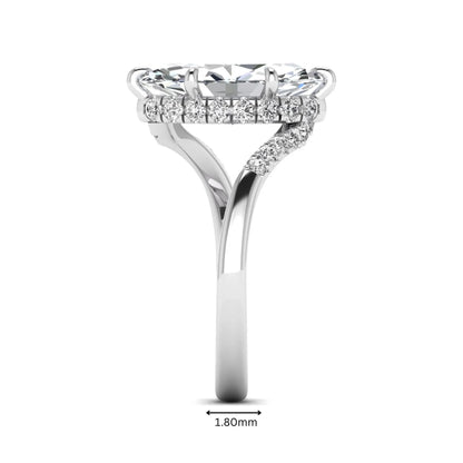 Marquise cut lab grown diamond engagement ring featuring a hidden halo, bypass shank, prong setting, and round accent diamonds in a white gold tone design.