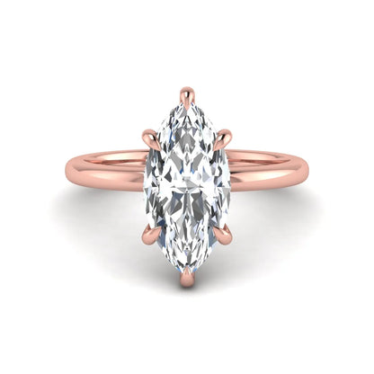 Marquise cut lab grown diamond solitaire engagement ring featuring a hidden halo, six-prong setting, and polished rose gold tone band.