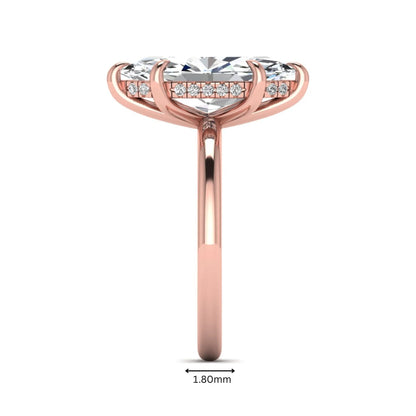 Marquise cut lab grown diamond solitaire engagement ring featuring a hidden halo, six-prong setting, and polished rose gold tone band.