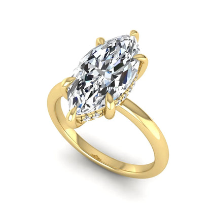 Marquise cut lab grown diamond solitaire engagement ring featuring a hidden halo, six-prong setting, and polished yellow gold tone band.