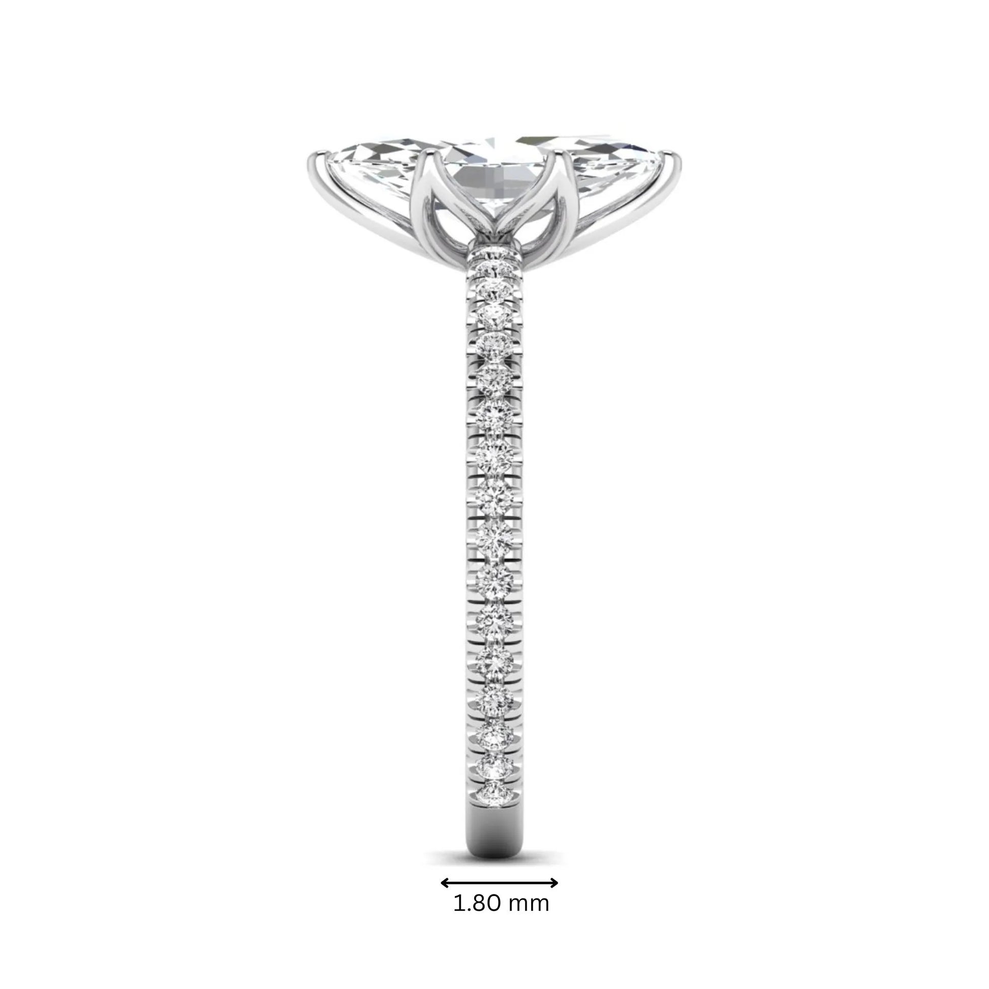 Marquise cut lab grown diamond engagement ring with an IGI certified center diamond and pavé round diamond band in white gold.