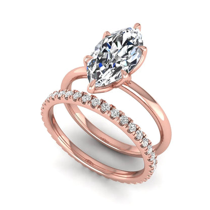 IGI Certified 2.11 carat marquise cut lab grown diamond engagement ring set with matching round diamond wedding band in rose gold.