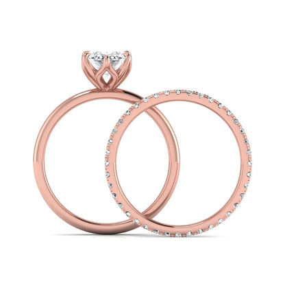 IGI Certified 2.11 carat marquise cut lab grown diamond engagement ring set with matching round diamond wedding band in rose gold.