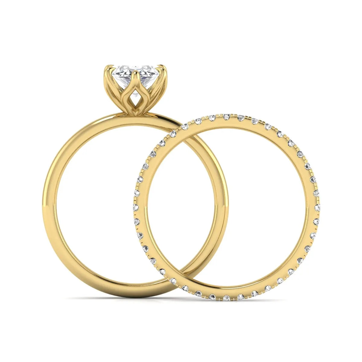 IGI Certified 2.11 carat marquise cut lab grown diamond engagement ring set with matching round diamond wedding band in yellow gold.