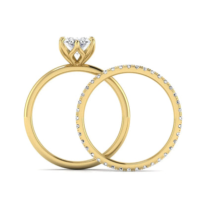 IGI Certified 2.11 carat marquise cut lab grown diamond engagement ring set with matching round diamond wedding band in yellow gold.