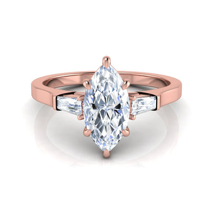 Marquise cut lab grown diamond engagement ring featuring a 0.95 carat IGI certified center diamond with baguette side diamonds in a rose gold three stone setting.