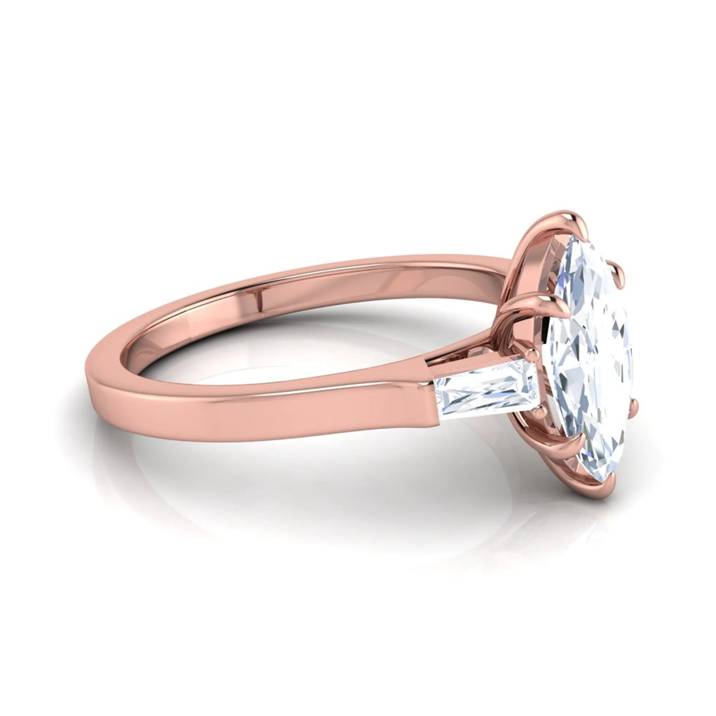 Marquise cut lab grown diamond engagement ring featuring a 0.95 carat IGI certified center diamond with baguette side diamonds in a rose gold three stone setting.