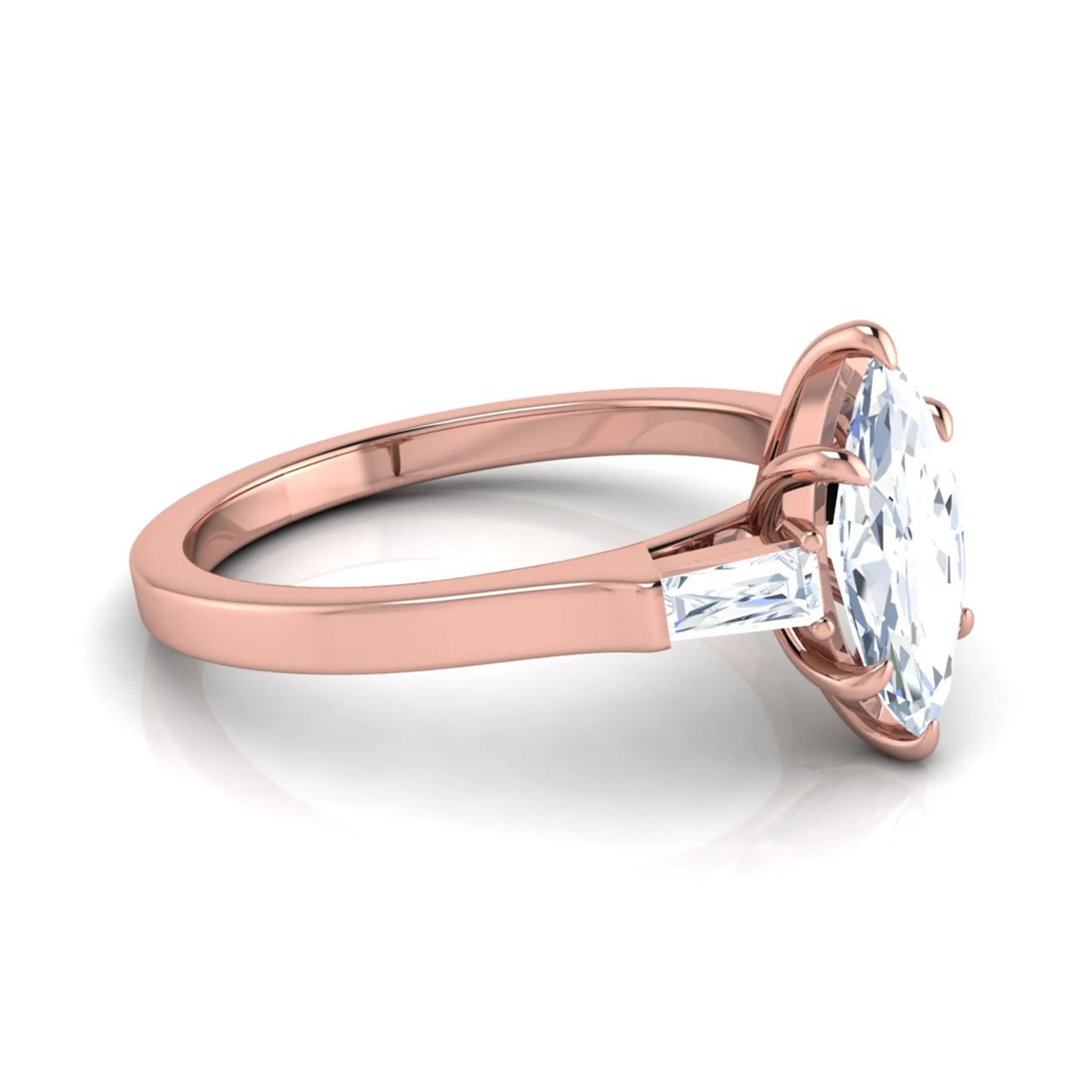 Marquise cut lab grown diamond engagement ring featuring a 0.95 carat IGI certified center diamond with baguette side diamonds in a rose gold three stone setting.