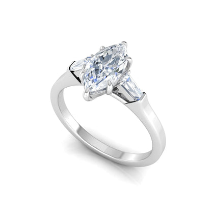 Marquise cut lab grown diamond engagement ring featuring a 0.95 carat IGI certified center diamond with baguette side diamonds in a white gold three stone setting.