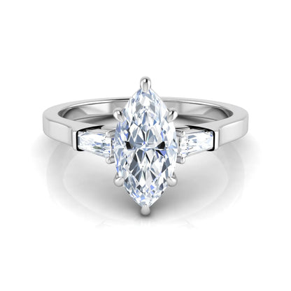 Marquise cut lab grown diamond engagement ring featuring a 0.95 carat IGI certified center diamond with baguette side diamonds in a white gold three stone setting.