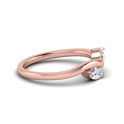 Nature-inspired marquise cut lab grown diamond leaf ring with two marquise diamonds on a gracefully curved polished band in rose gold