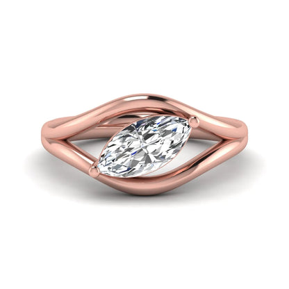 Marquise cut lab grown diamond open frame solitaire engagement ring in a rose gold sculptural setting