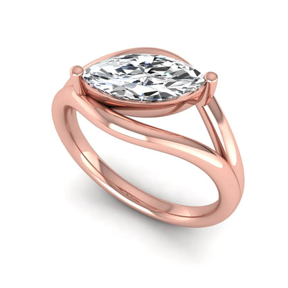 Marquise cut lab grown diamond open frame solitaire engagement ring in a rose gold sculptural setting