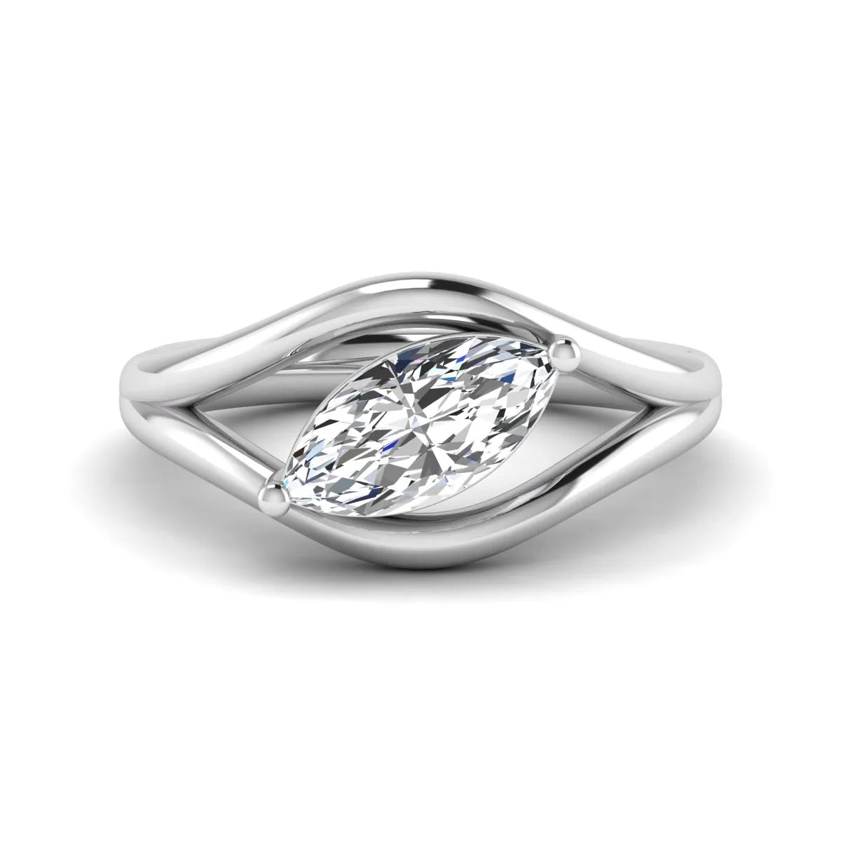 Marquise cut lab grown diamond open frame solitaire engagement ring in a white gold sculptural setting