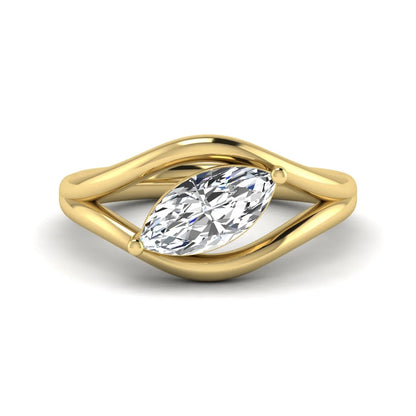 Marquise cut lab grown diamond open frame solitaire engagement ring in a yellow gold sculptural setting