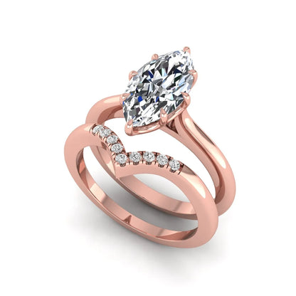 Marquise cut lab grown diamond bypass engagement ring with round side diamonds in a prong setting and rose gold tone band.