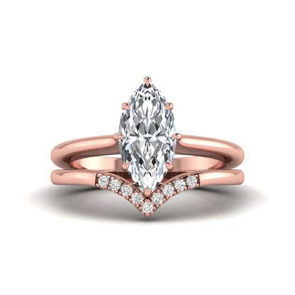 Marquise cut lab grown diamond bypass engagement ring with round side diamonds in a prong setting and rose gold tone band.