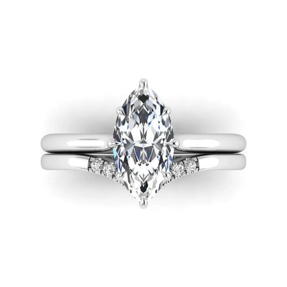 Marquise cut lab grown diamond bypass engagement ring with round side diamonds in a prong setting and white gold tone band.