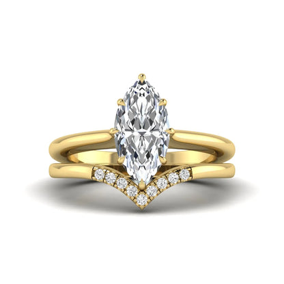 Marquise cut lab grown diamond bypass engagement ring with round side diamonds in a prong setting and yellow gold tone band.
