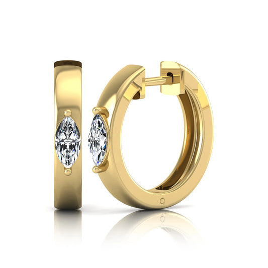 Marquise cut lab grown diamond huggie hoop earrings featuring a classic four prong setting and hinged snap closure shown in yellow gold tone with a polished finish.