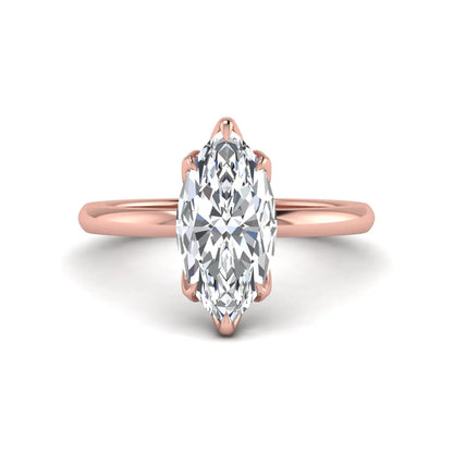 Marquise cut lab grown diamond solitaire engagement ring with six prong setting in rose gold tone featuring an elongated elegant design.