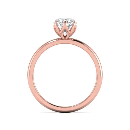 Marquise cut lab grown diamond solitaire engagement ring with six prong setting in rose gold tone featuring an elongated elegant design.