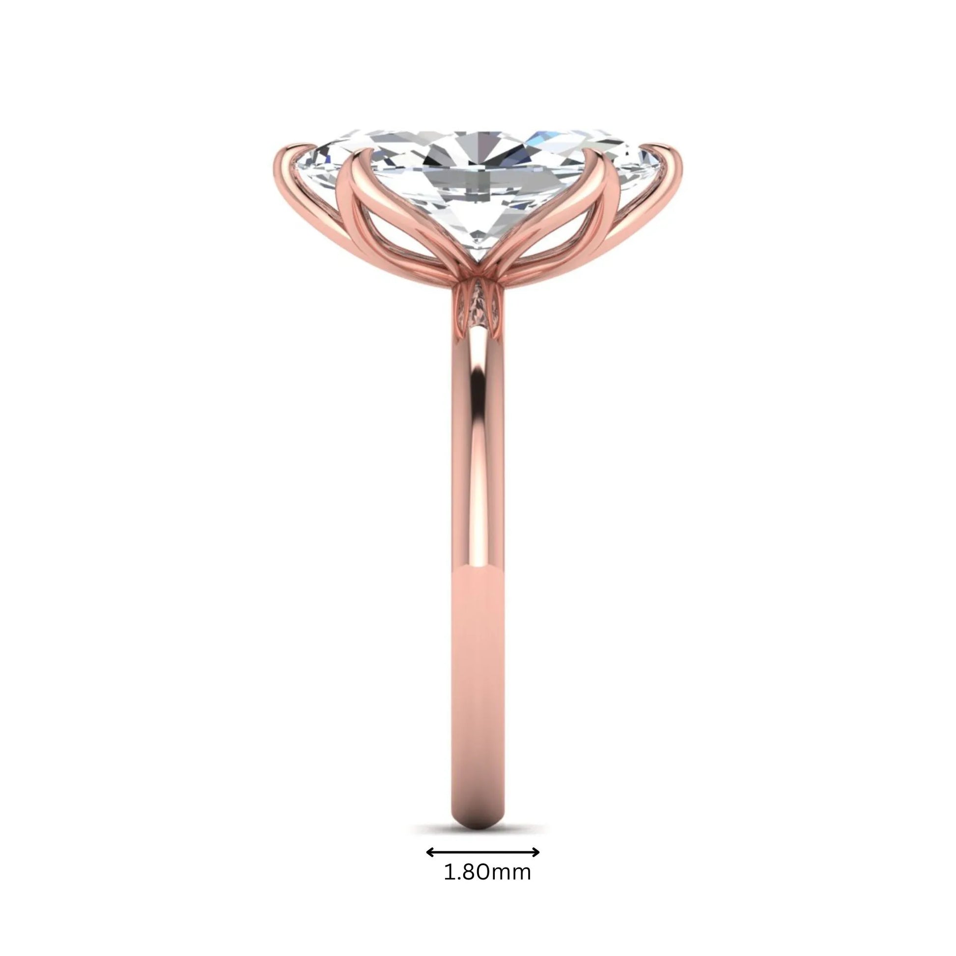 Marquise cut lab grown diamond solitaire engagement ring with six prong setting in rose gold tone featuring an elongated elegant design.