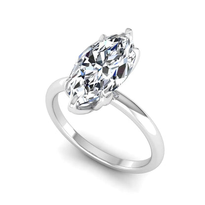 Marquise cut lab grown diamond solitaire engagement ring with six prong setting in white gold tone featuring an elongated elegant design.