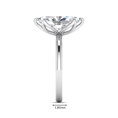 Marquise cut lab grown diamond solitaire engagement ring with six prong setting in white gold tone featuring an elongated elegant design.