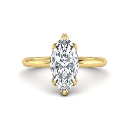 Marquise cut lab grown diamond solitaire engagement ring with six prong setting in yellow gold tone featuring an elongated elegant design.