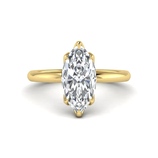 Marquise cut lab grown diamond solitaire engagement ring with six prong setting in yellow gold tone featuring an elongated elegant design.