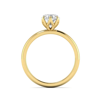 Marquise cut lab grown diamond solitaire engagement ring with six prong setting in yellow gold tone featuring an elongated elegant design.