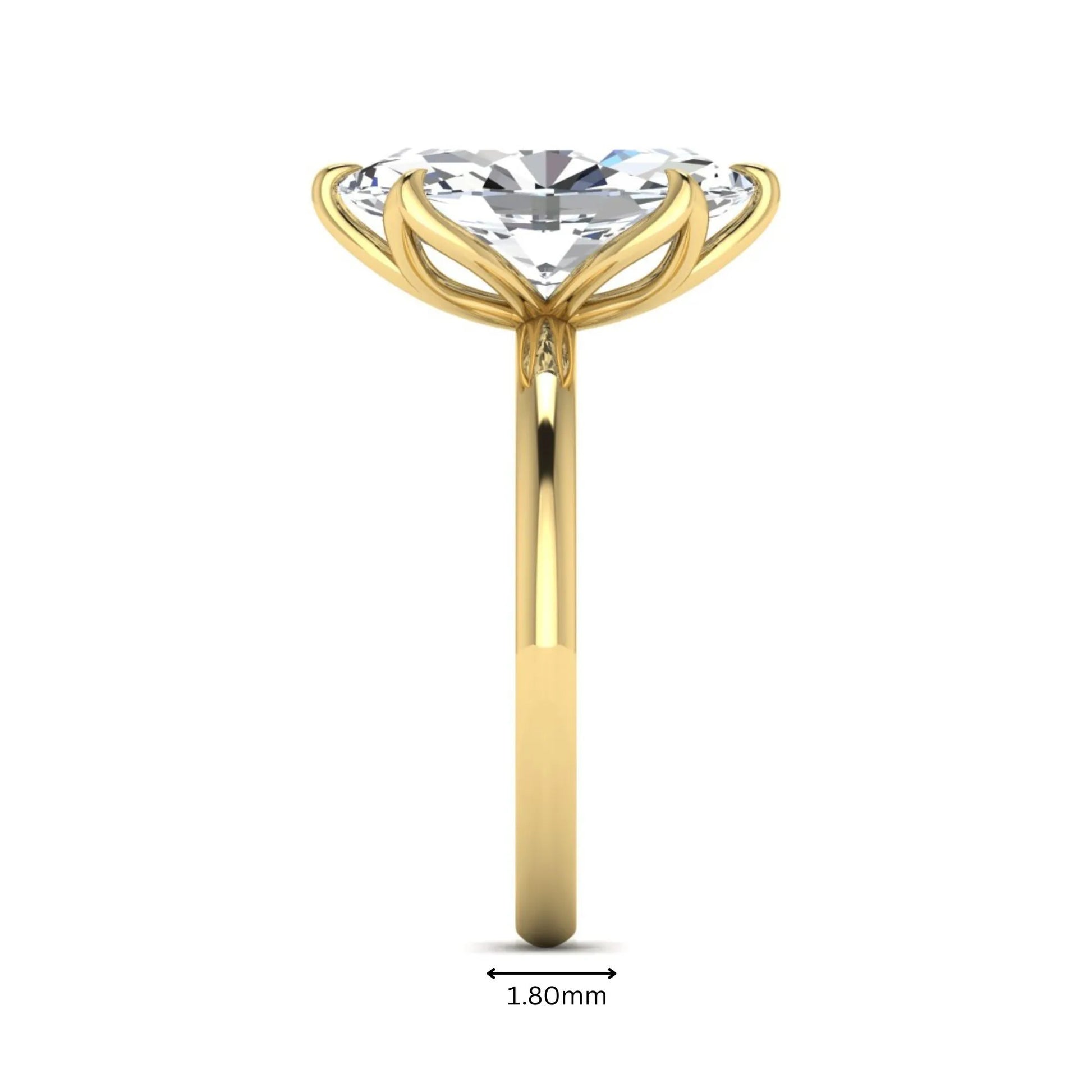 Marquise cut lab grown diamond solitaire engagement ring with six prong setting in yellow gold tone featuring an elongated elegant design.