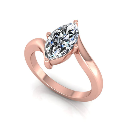 Marquise cut lab grown diamond solitaire engagement ring featuring a four-prong setting with an elegant bypass-style band in rose gold finish.