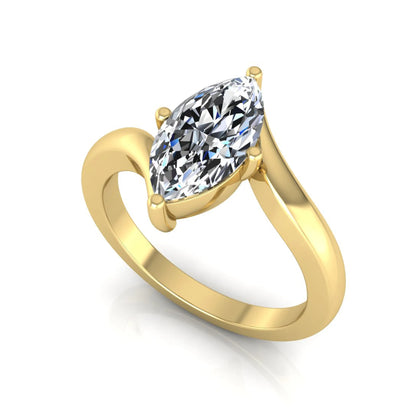 Marquise cut lab grown diamond solitaire engagement ring featuring a four-prong setting with an elegant bypass-style band in yellow gold finish.