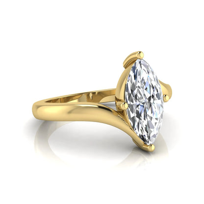 Marquise cut lab grown diamond solitaire engagement ring featuring a four-prong setting with an elegant bypass-style band in yellow gold finish.