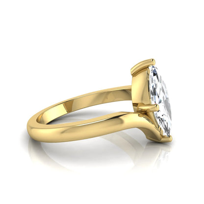Marquise cut lab grown diamond solitaire engagement ring featuring a four-prong setting with an elegant bypass-style band in yellow gold finish.