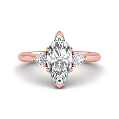 Marquise cut lab grown diamond three stone engagement ring with prong setting, round and pear side diamonds, rose gold tone shown for design reference.