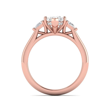 Marquise cut lab grown diamond three stone engagement ring with prong setting, round and pear side diamonds, rose gold tone shown for design reference.