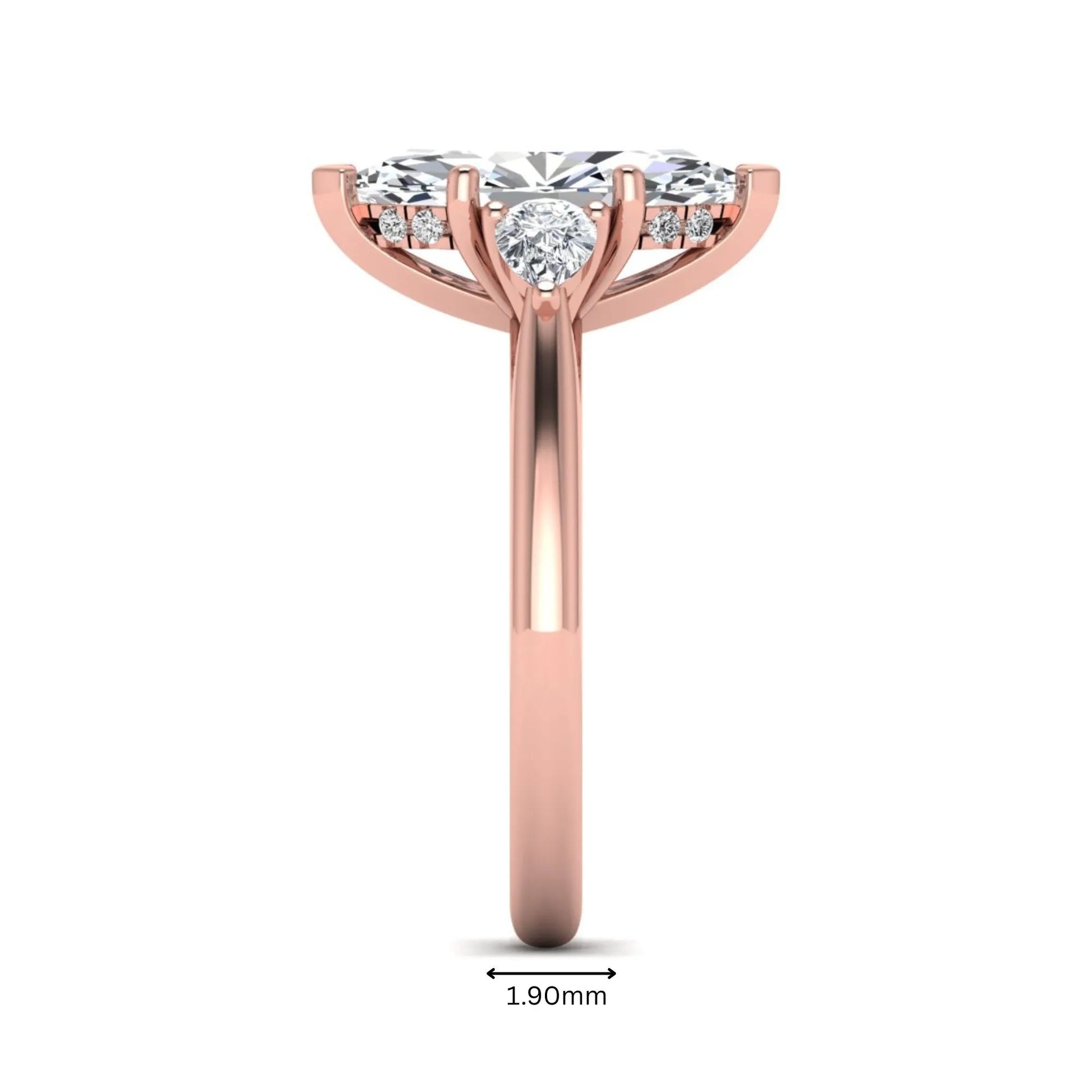 Marquise cut lab grown diamond three stone engagement ring with prong setting, round and pear side diamonds, rose gold tone shown for design reference.