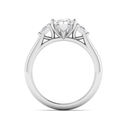 Marquise cut lab grown diamond three stone engagement ring with prong setting, round and pear side diamonds, white gold tone shown for design reference.