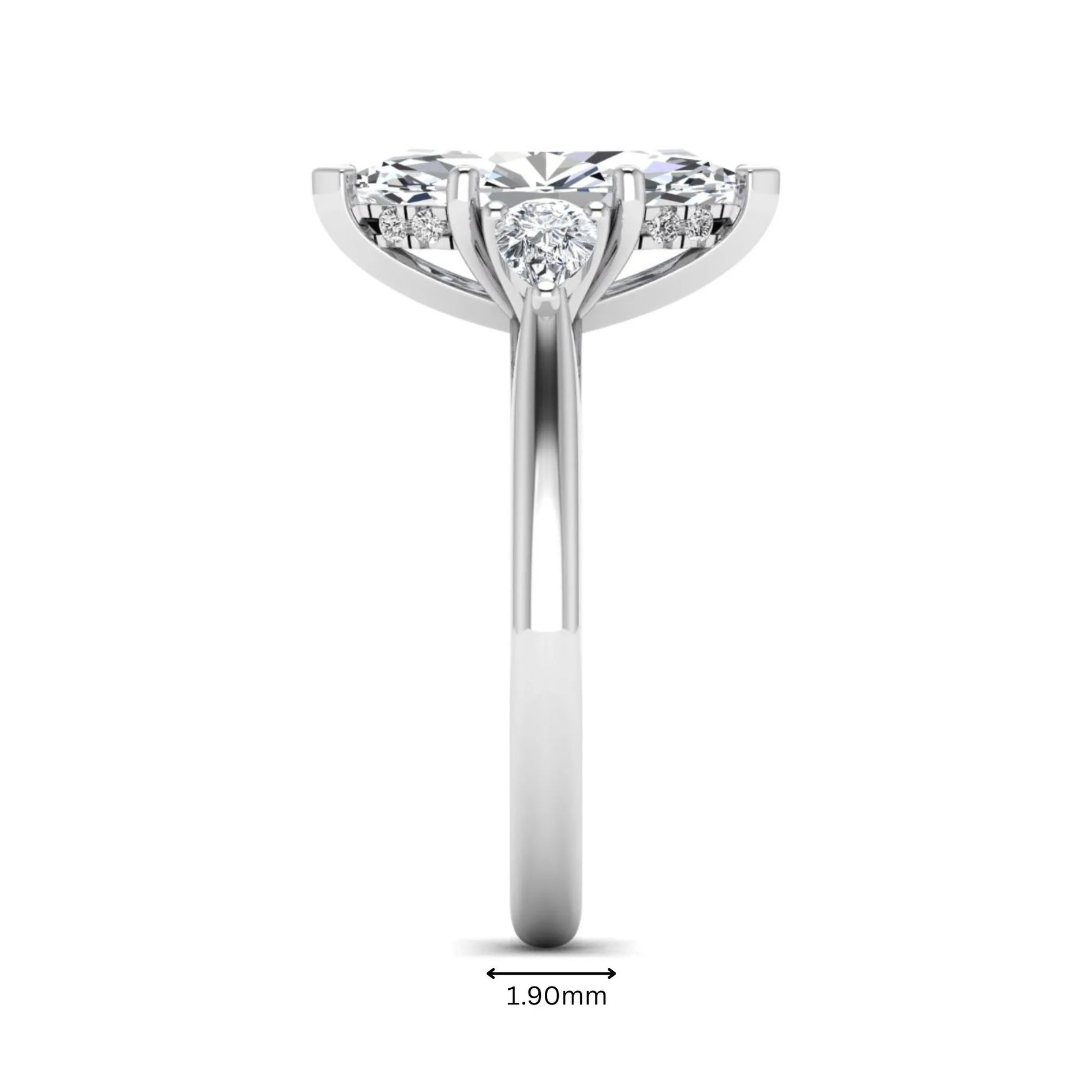 Marquise cut lab grown diamond three stone engagement ring with prong setting, round and pear side diamonds, white gold tone shown for design reference.