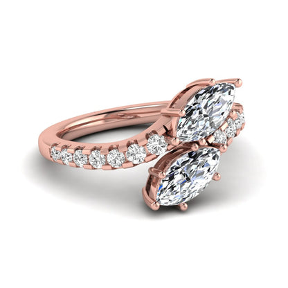 Marquise and round cut lab grown diamond bypass ring with prong setting in rose gold tone.