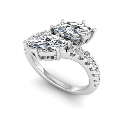 Marquise and round cut lab grown diamond bypass ring with prong setting in white gold tone.