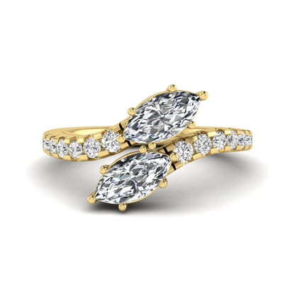 Marquise and round cut lab grown diamond bypass ring with prong setting in yellow gold tone.