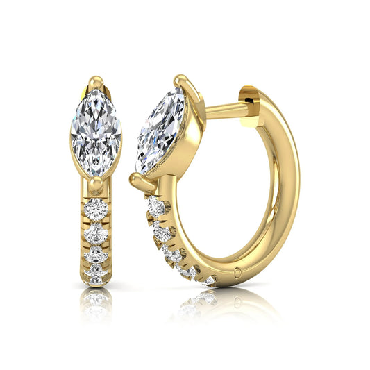 Marquise and round lab grown diamond pavé huggie hoop earrings featuring a vertical two prong marquise center diamond with graduated round pavé diamond accents in yellow gold.